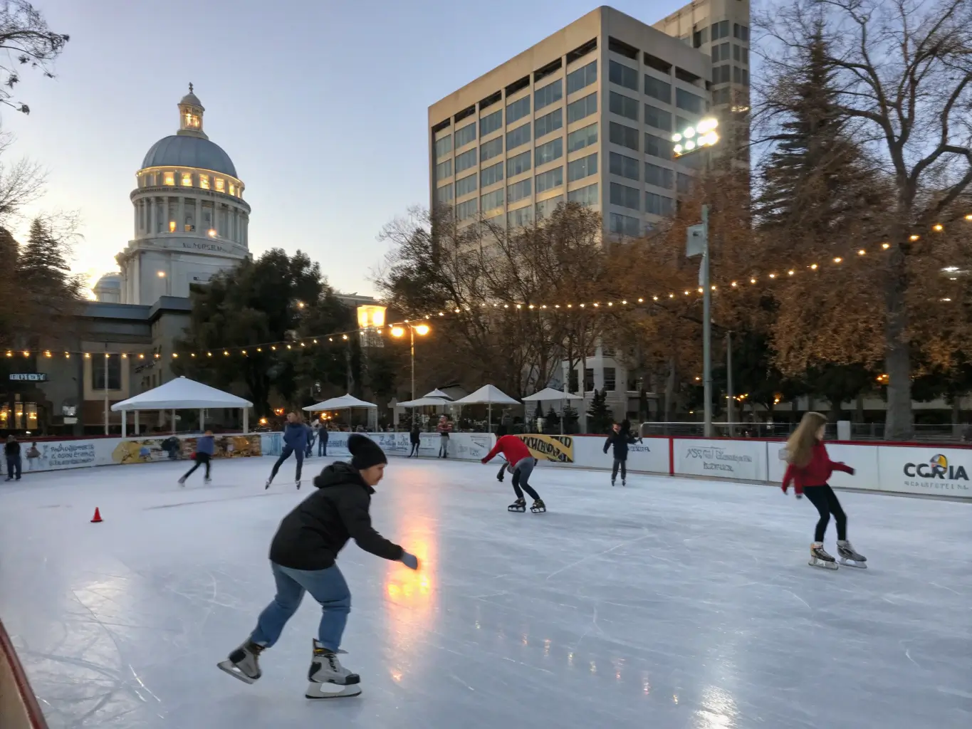 Ice skaters of various skill levels gliding at Downtown Sacramento Ice Rink in dynamic motion, illuminated by crisp winter light