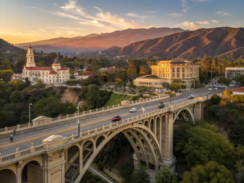 "Sunset view of Pasadena cityscape featuring Colorado Street Bridge, JPL's satellite arrays, lush Arlington Garden, Eaton Canyon, and historic Old Pasadena architecture, with people enjoying outdoor activities, all under the backdrop of San Gabriel Mountains."