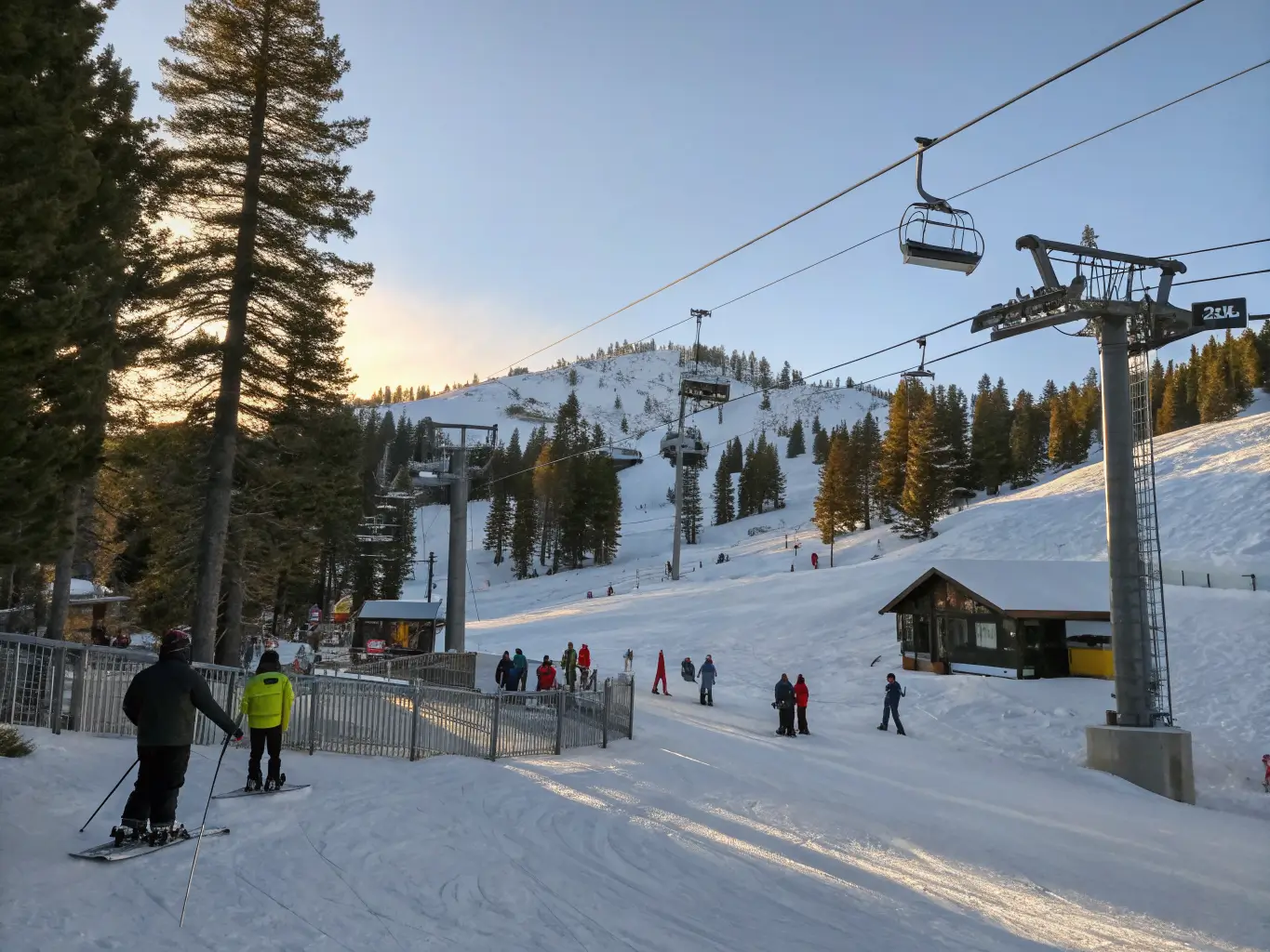 Mammoth Lakes in March: What to Actually Expect Wide-angle view of a quiet Mammoth Mountain chairlift base on a sunny March morning, few skiers waiting in line, groomed snow and snowy pines in golden light with long blue shadows.